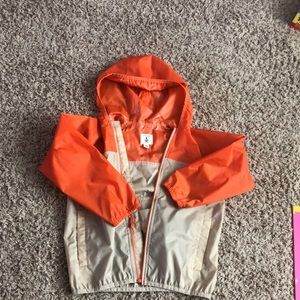 Tan/orange kids raincoat, Lands’ End.